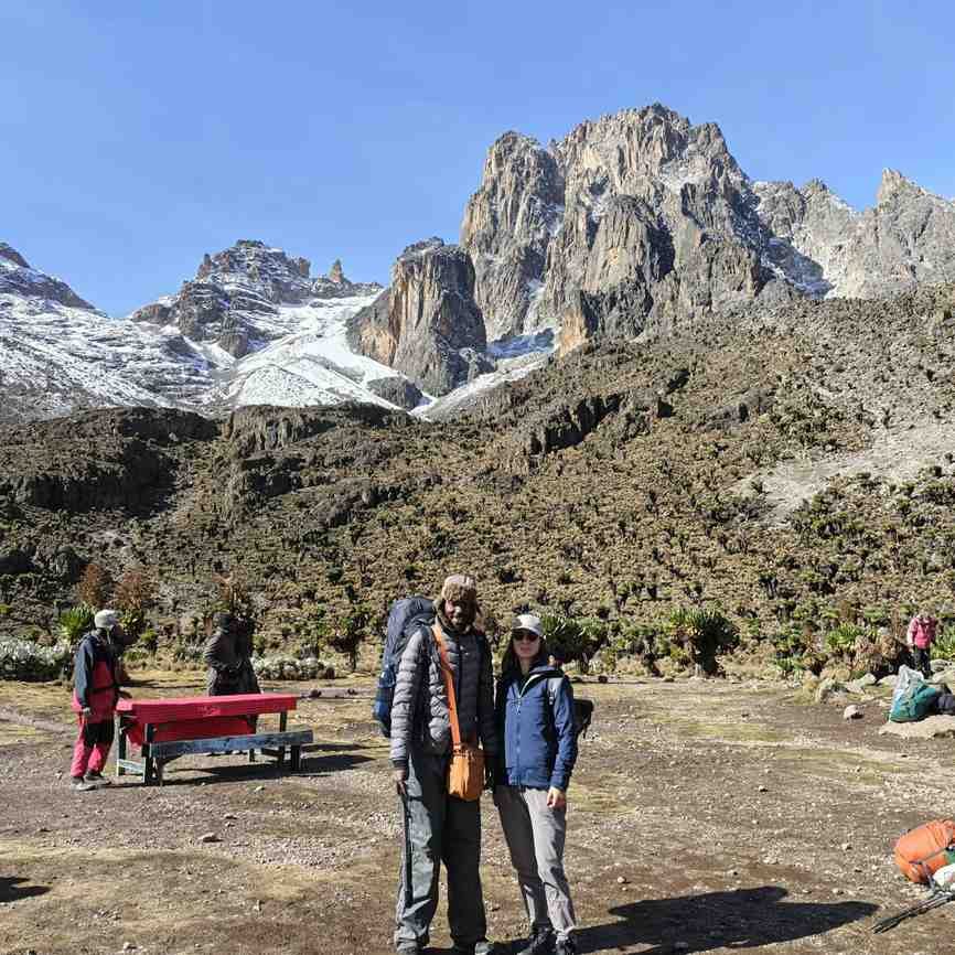 Couple posing on the snowy peaks of Mount Kenya
